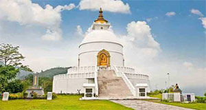 A big stupa stand on top of the hills