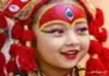 Kumari Devi, the Living Goddess of Nepal, wearing traditional attire and ornate ceremonial jewelry